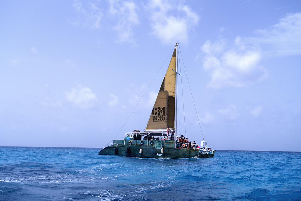 Adventure onboard a catamaran into the turquoise waters of the Mexican Caribbean